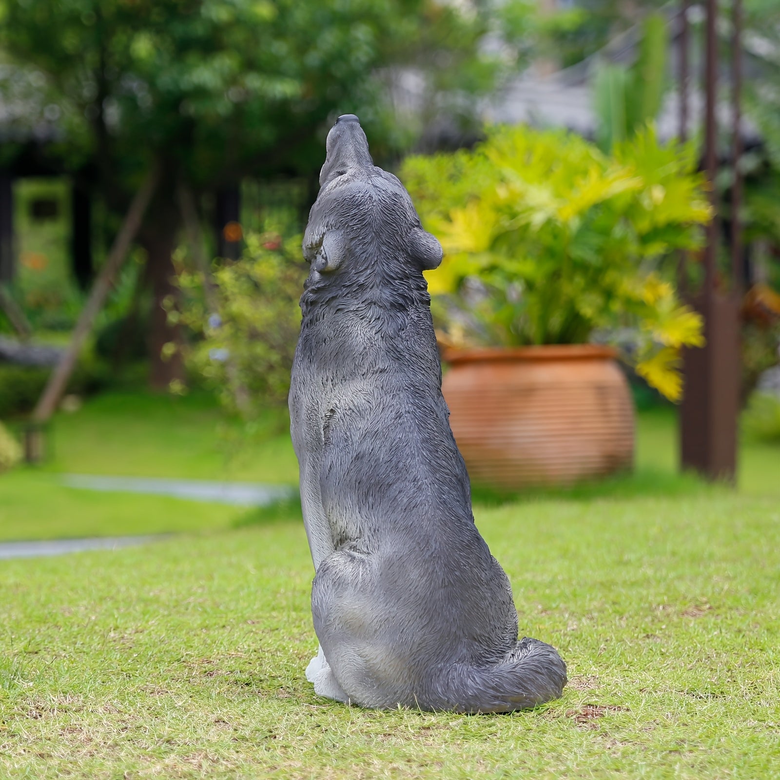 Three Realistic Howling Wolf Sculptures