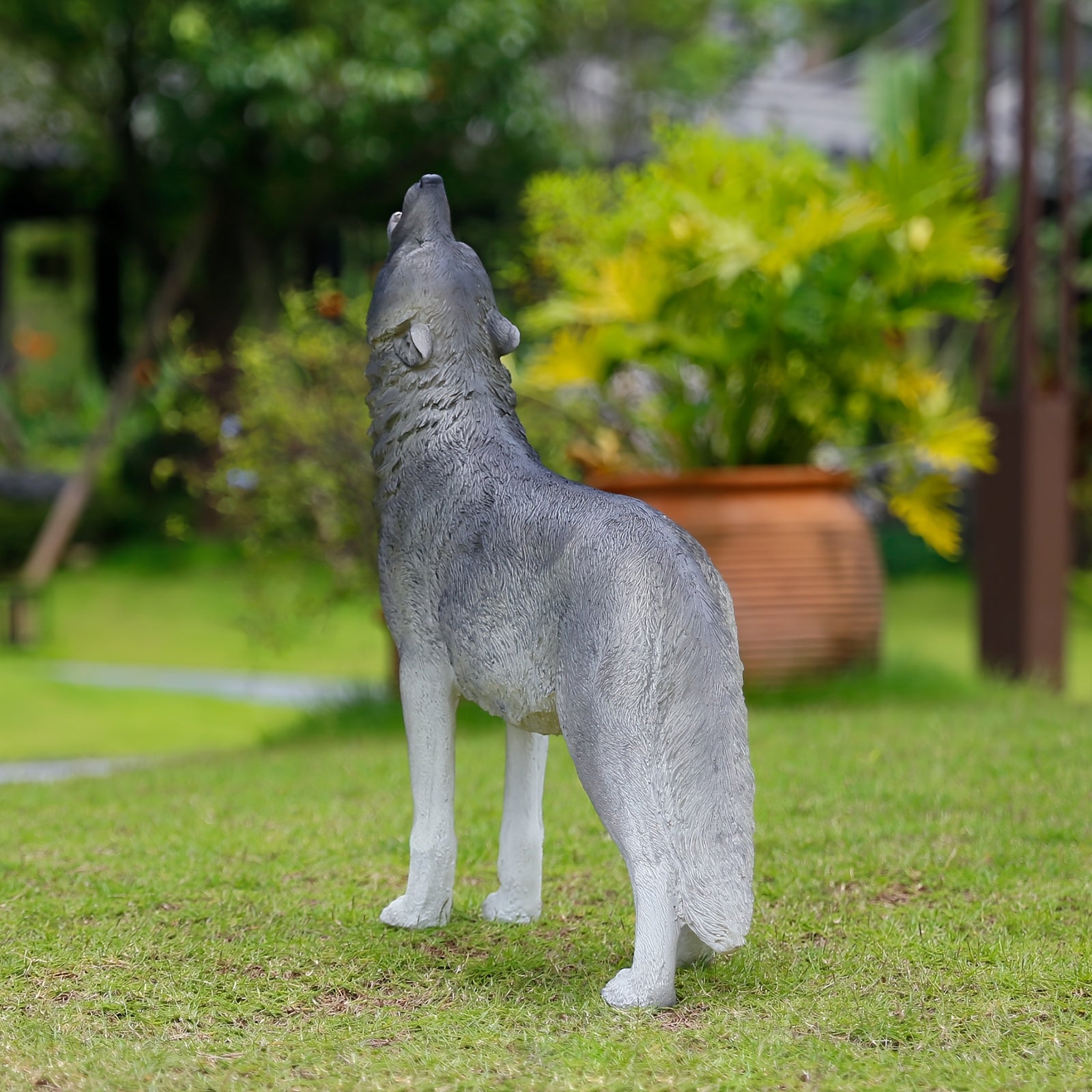 Three Realistic Howling Wolf Sculptures