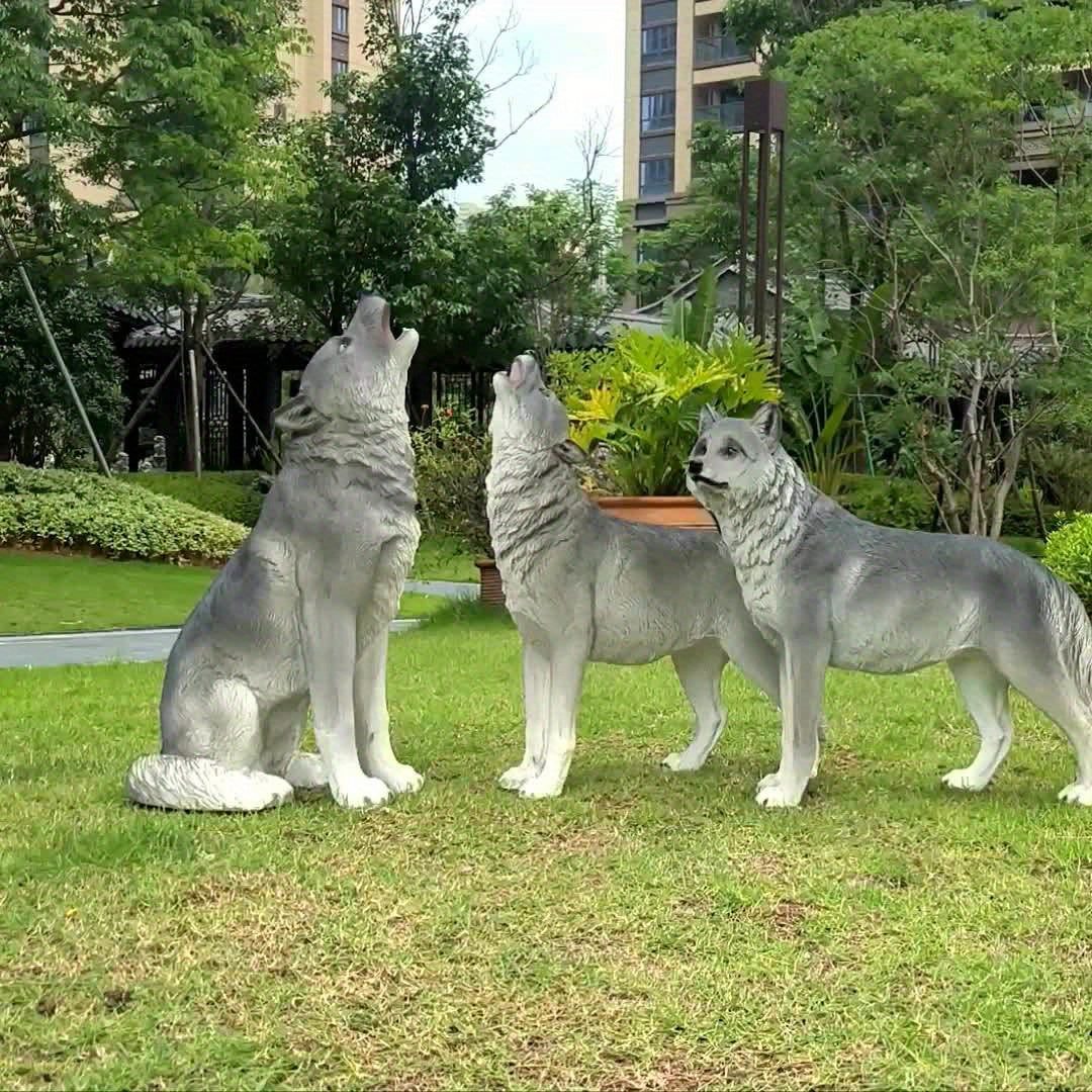 Three Realistic Howling Wolf Sculptures