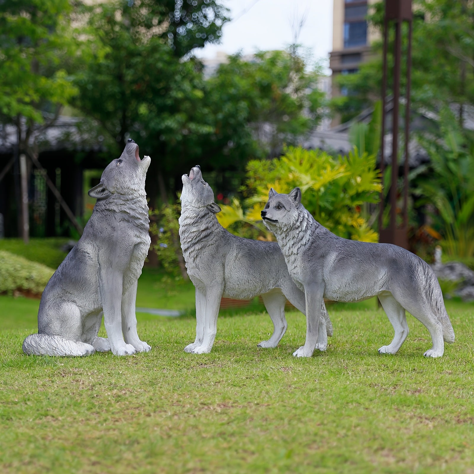Three Realistic Howling Wolf Sculptures