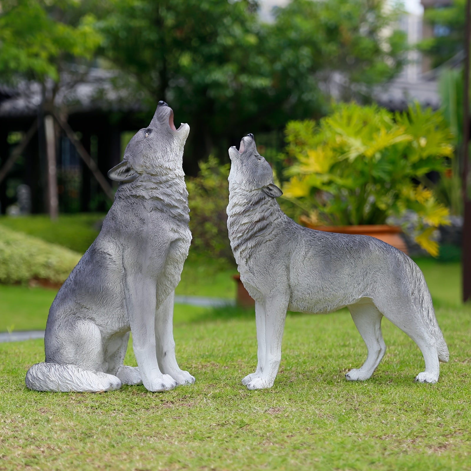 Three Realistic Howling Wolf Sculptures