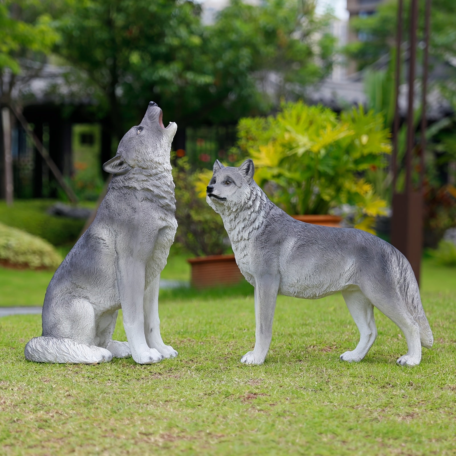 Three Realistic Howling Wolf Sculptures