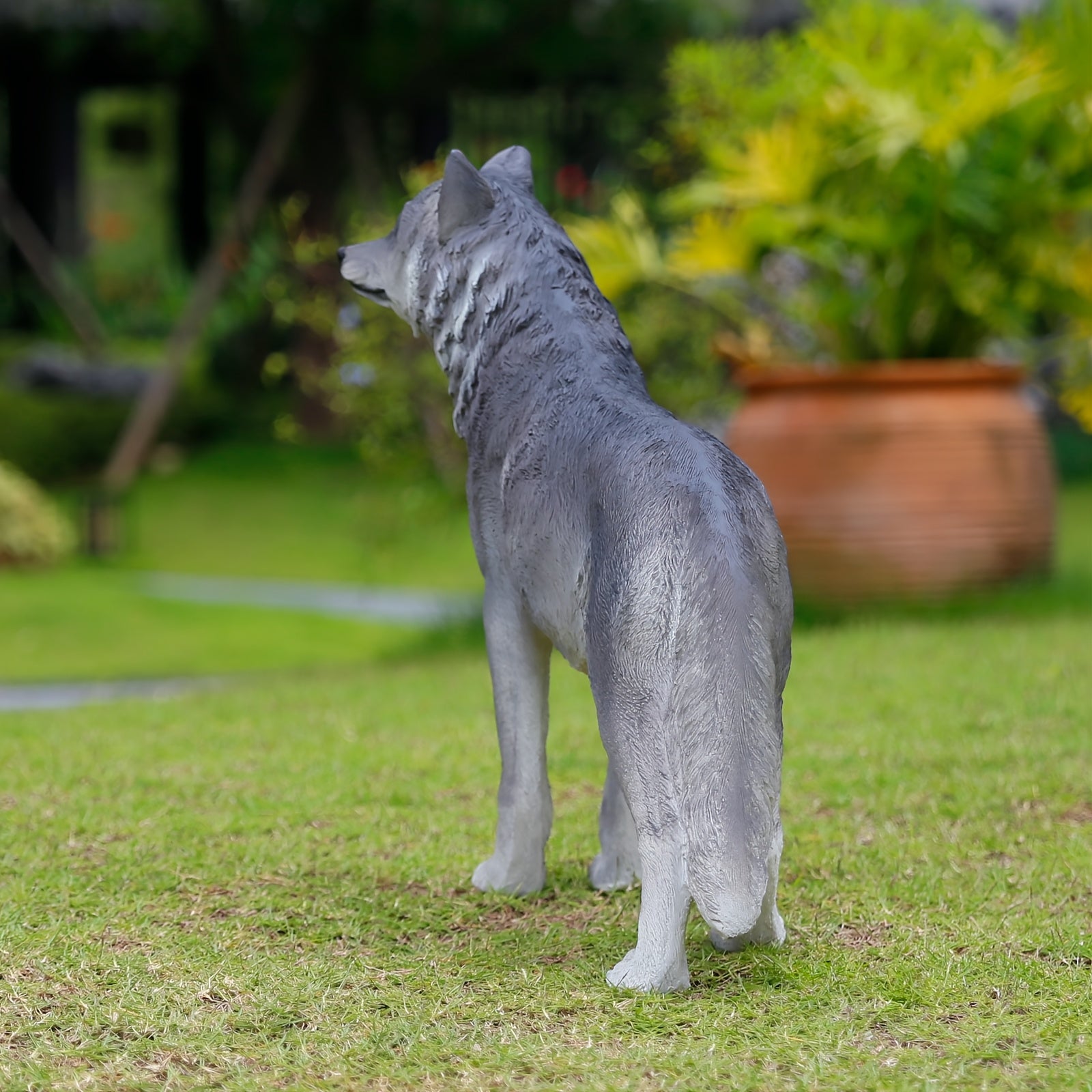 Three Realistic Howling Wolf Sculptures
